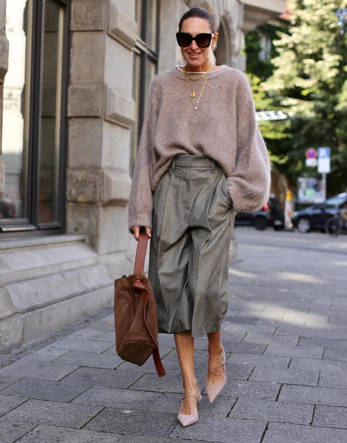 Cozy neutral outfit with grey culottes and a beige sweater.