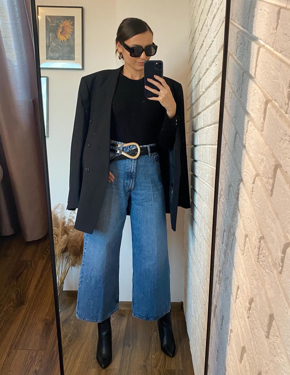 Denim culottes with a black oversized blazer and black ankle boots.